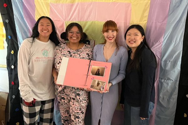 American Studies students have an annual project called "What is an American?" where students come up with a defensible thesis and write an essay as well as create a project. Pictured are American Studies teachers Ashley Harrison and Whitney Schell with seniors Sophia Hung and Christine Han with their projects. Han and Hung created a quilt and a scrapbook manual that explains the quilt for their thesis. 