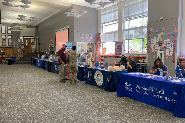 Representatives from Collin College, Texas State Technical College, the United States Air Force, and various other institutions gather and prepare for students to arrive at the Trade Fair.