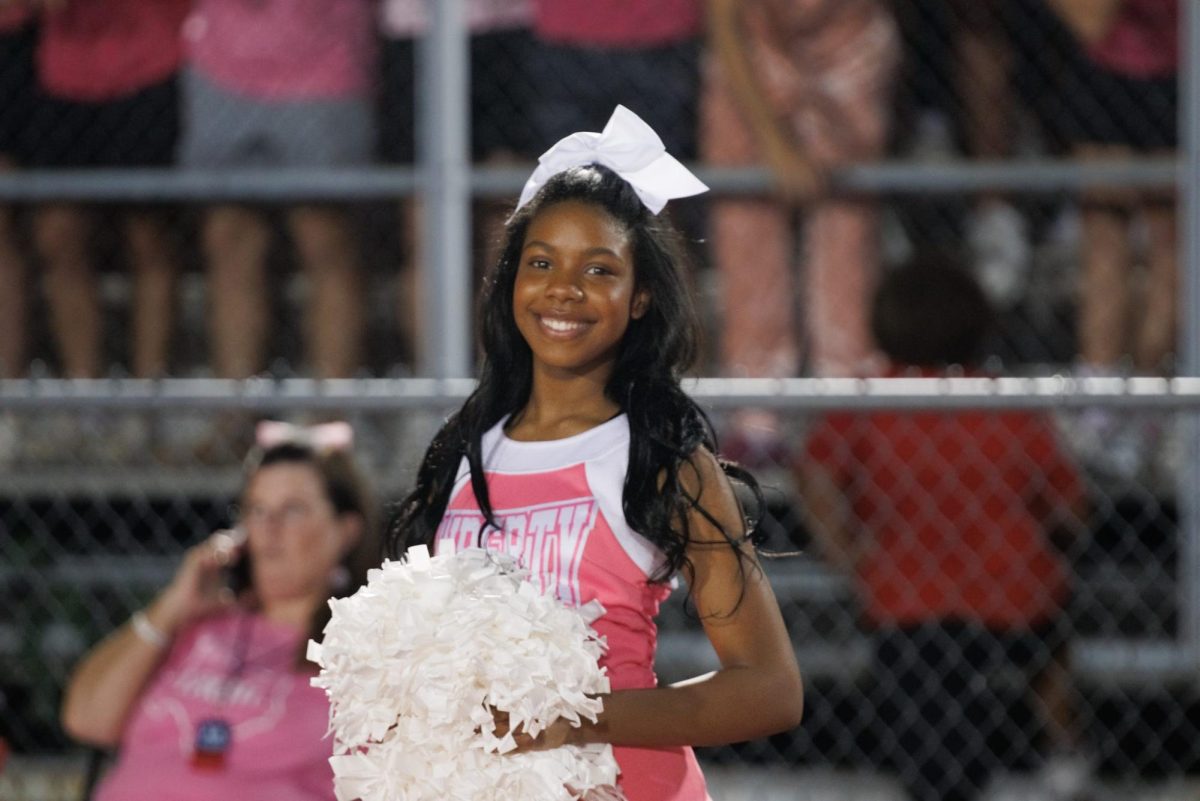 Cheerleaders are the center of the student section. They wear pink uniforms and shake their poms poms to not only cheer on the team but to highlight the dangers fo breast cancer. 