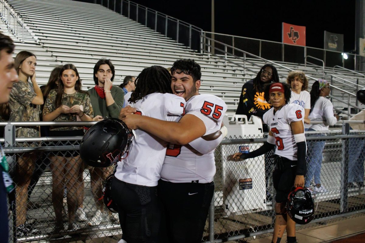 Sophomore Ibrahim Lofty embraces his teammate as the team snatches the first win of the season and in three years from the Memorial Warriors. 