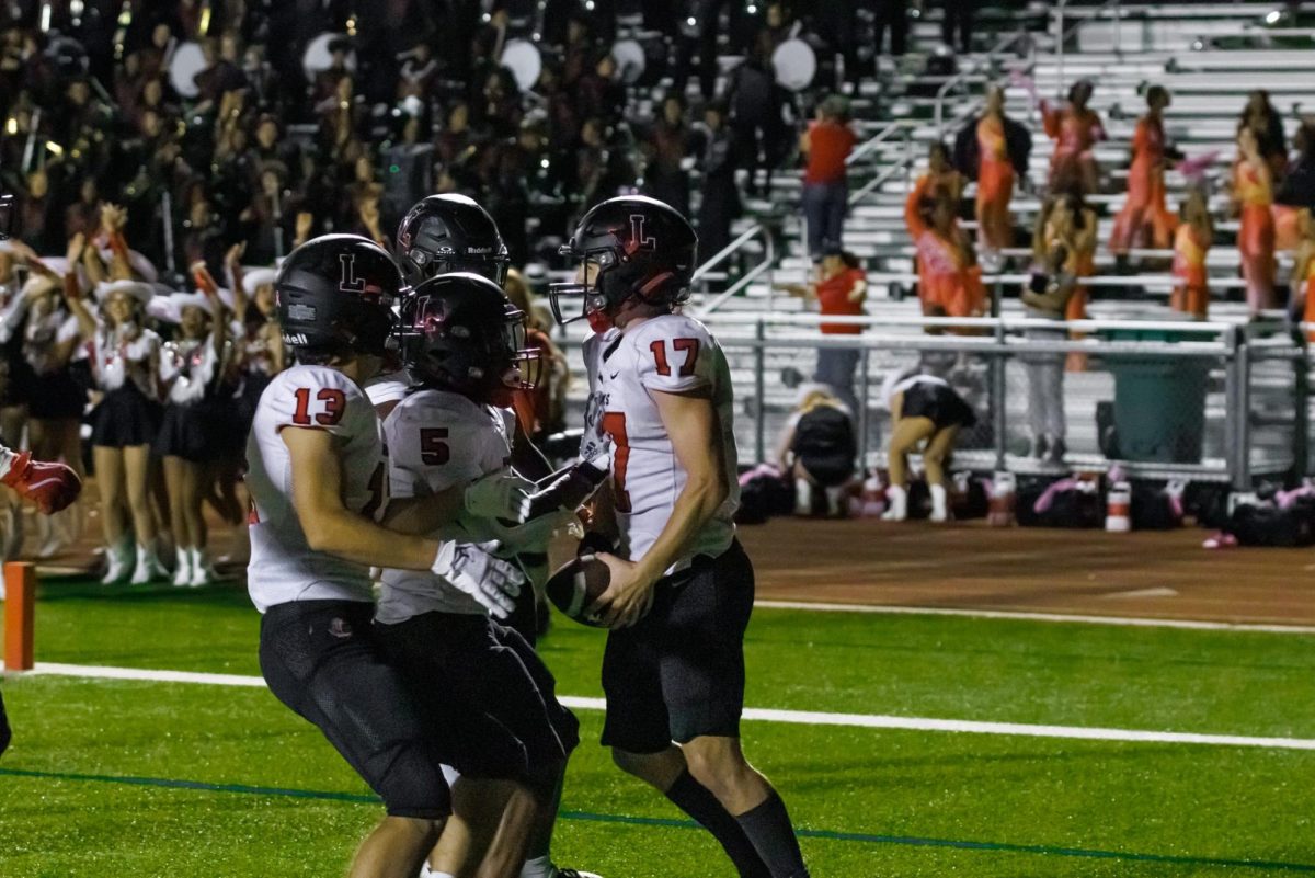 Landon Reygadas scores a touchdown, bringing the team closer to victory. The players have the energy bring them up. 