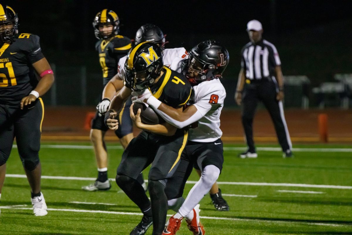 Brian Chandler tackles a Warrior from behind, trying to prevent the ball from reaching their endzone. 