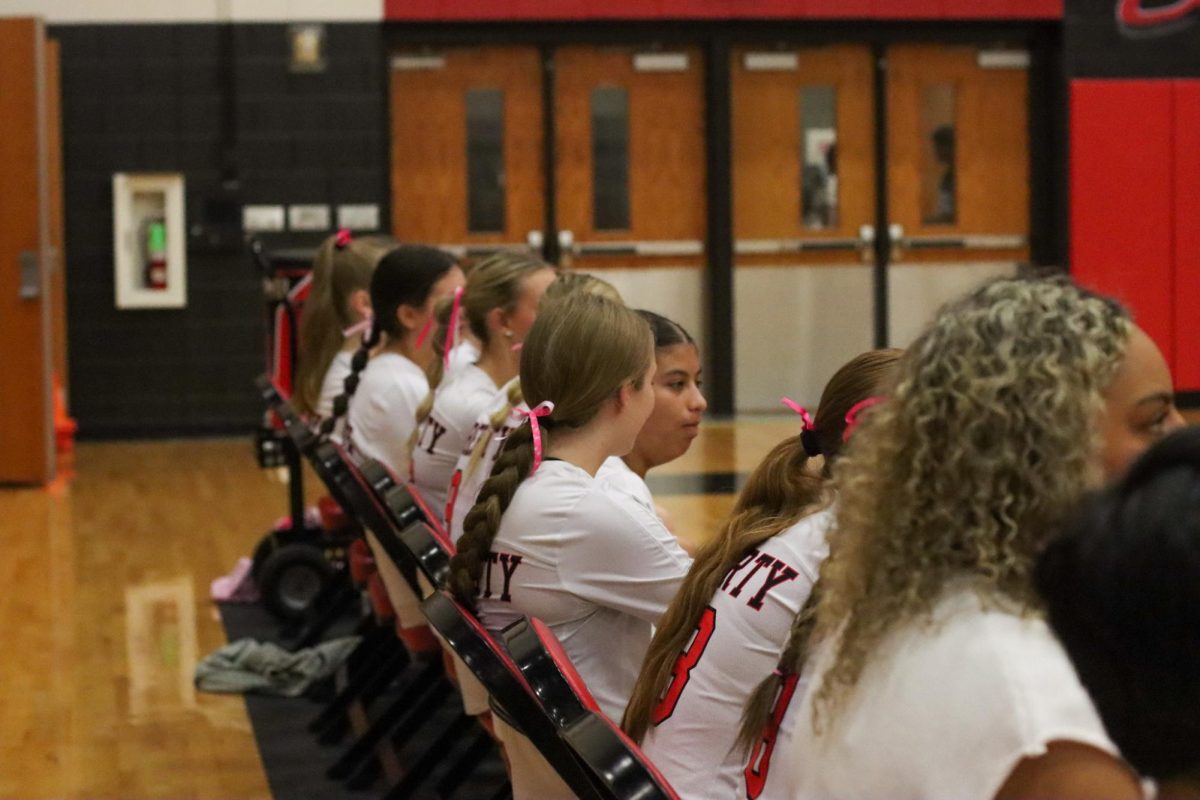 The benches are filled with athletes waiting for their cues to be subbed in. But Pink Out night is extra special because players sport pink bows for the annual pink out game. 