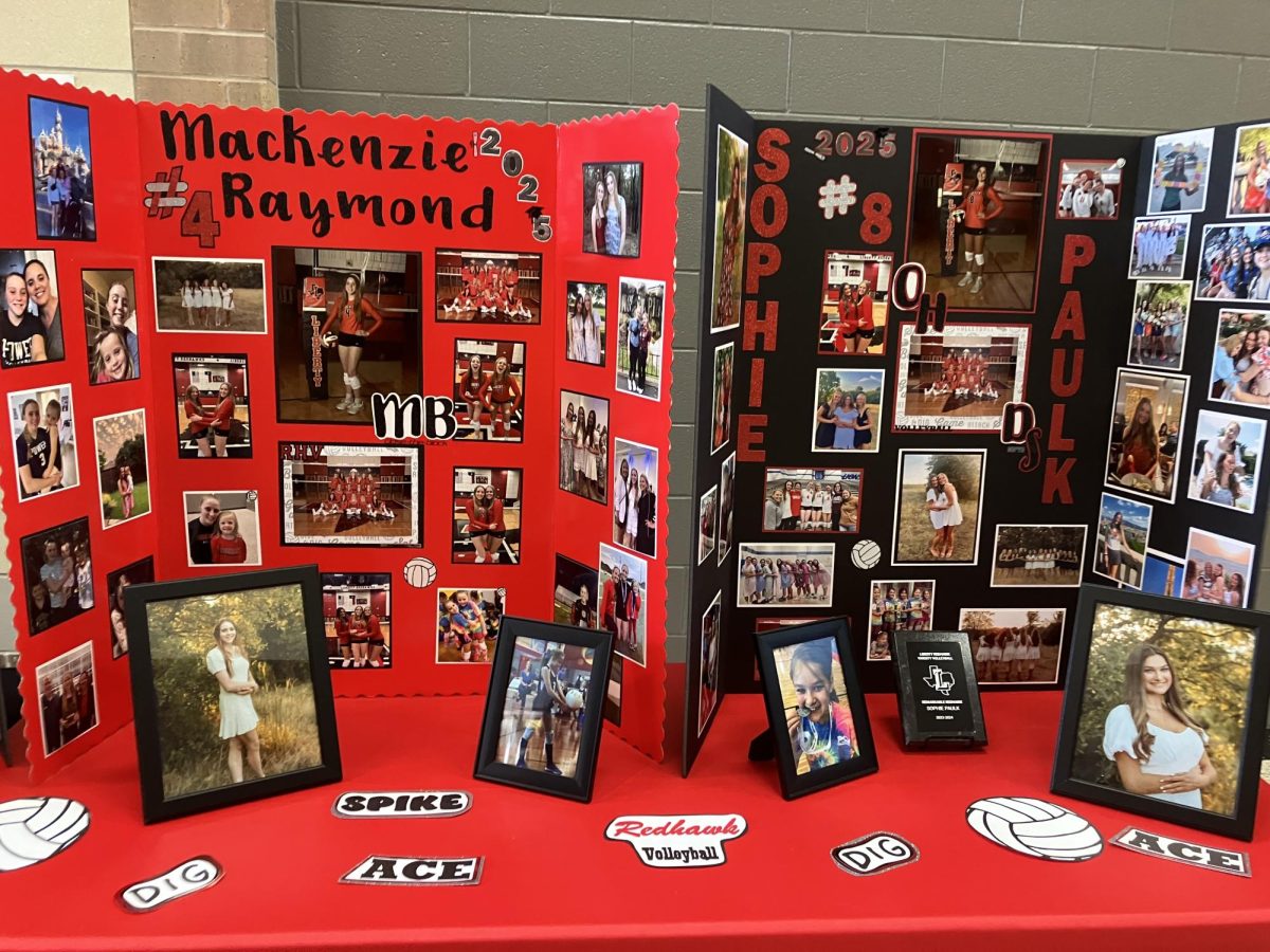 Volleyball swept Heritage at the Redhawk's senior night home match Friday, maintaining  their first-place district standing. Seen here are posters celebrating seniors Mackenzie Raymond and Sophie Paulk.