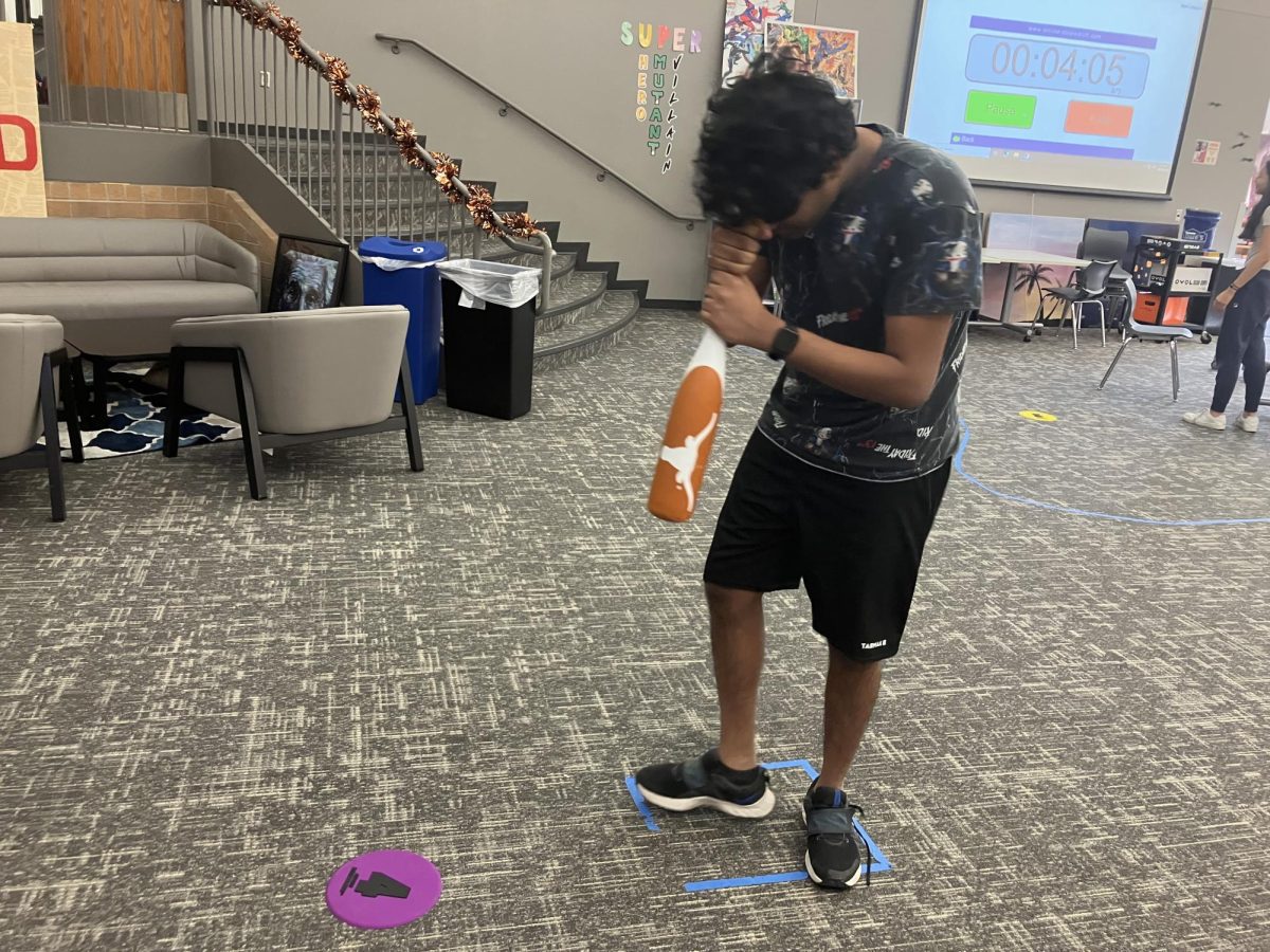  Junior Sirish Shabash spins around blidnfolded prior to a test of his vestibular senses

