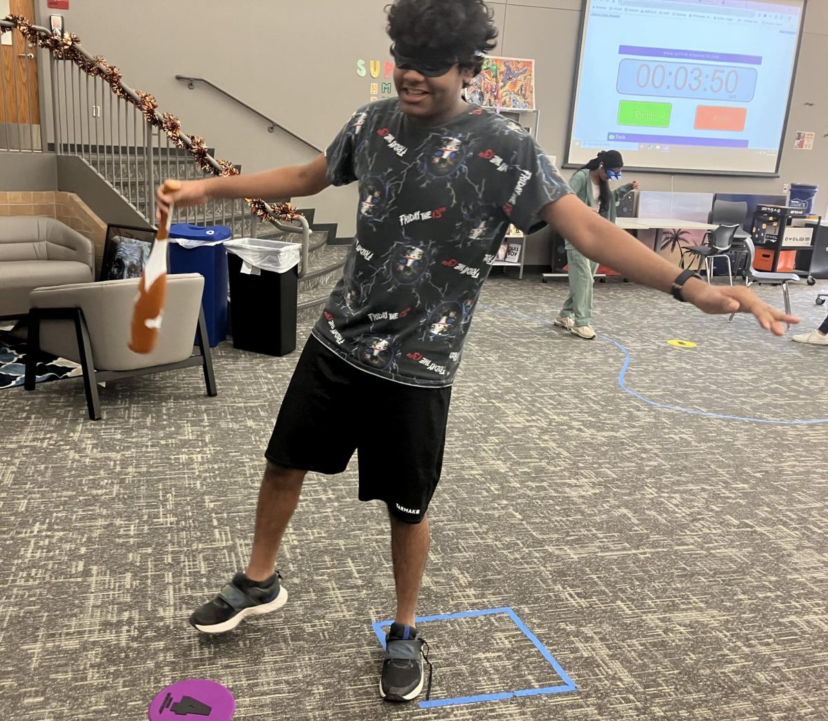  Junior Sirish Shabash spins around blindfolded prior to a test of his vestibular senses
