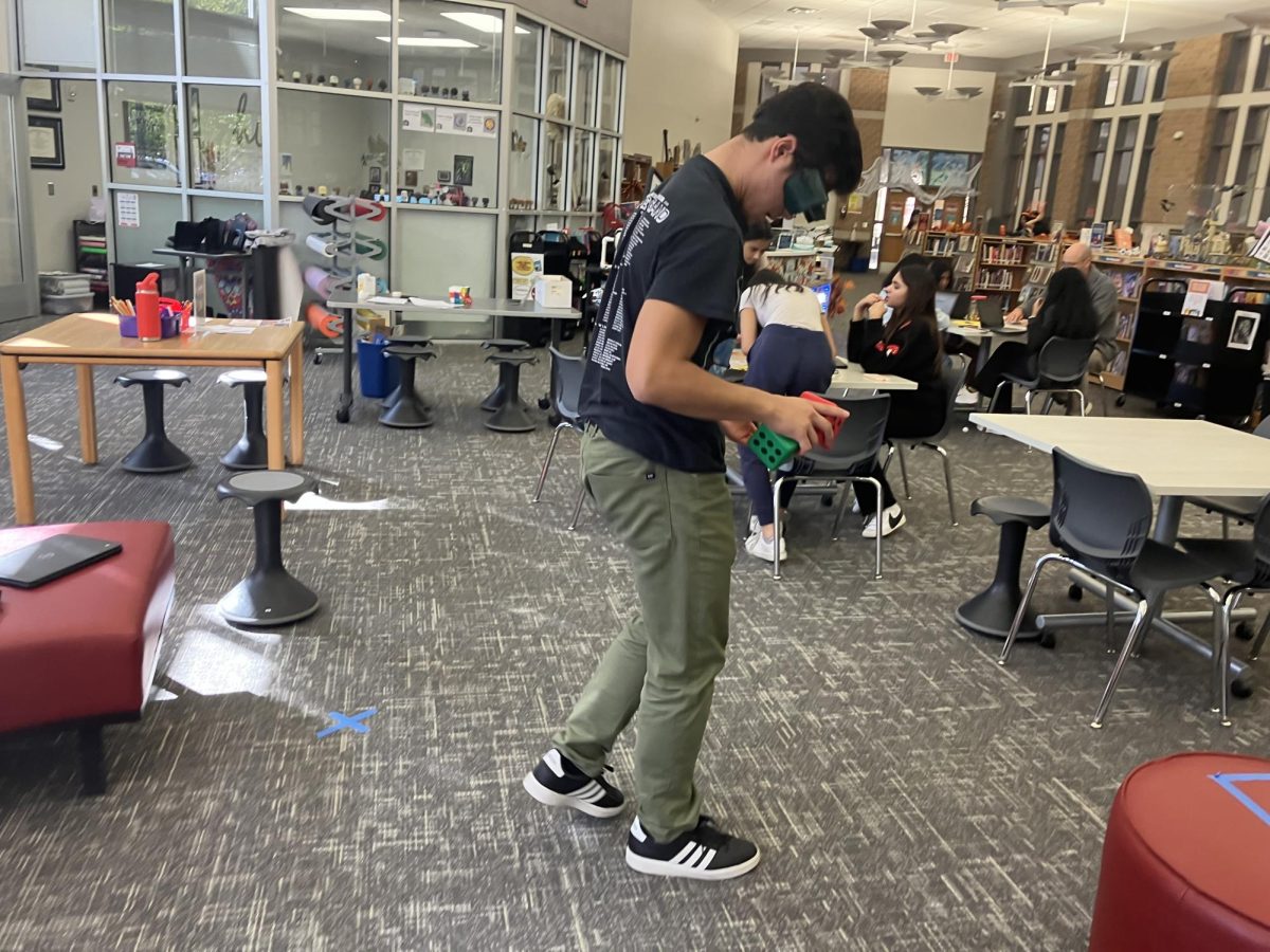 Junior Todd Stiles attempts to walk while wearing goggles that simulate the effects of impaired perception.
