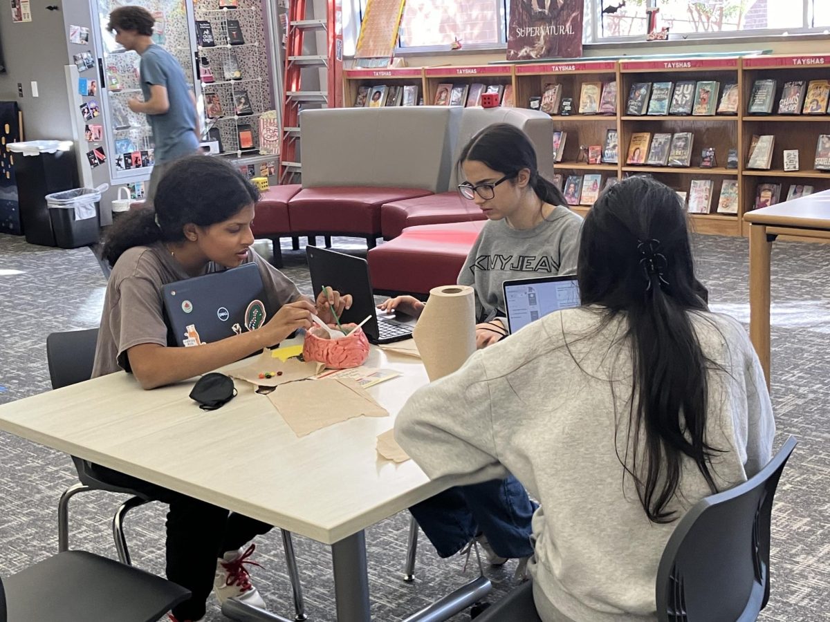 - AP Psychology students, juniors Reyna Gannamani,Hala Asadieh, and Zaina Mirza participate in the blindfolded Skittle-eating experiment
