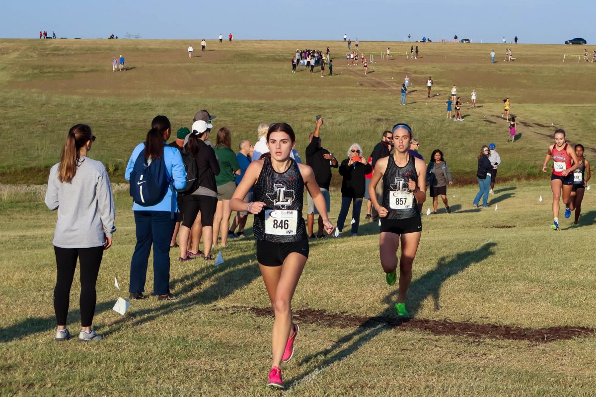 Leading the way, girls’ cross country team wins district championship