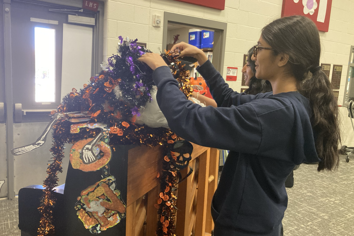 Falloween might be at the end of the week, but for orchestra officers like juniors Shriya Satish and Saanvi Patel, the decoration process begins days before.