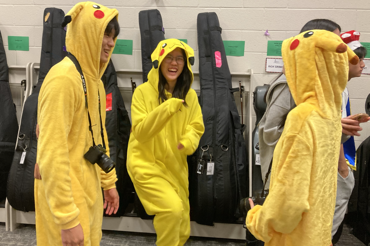 Senior John Fu, junior Christine Wu, and sophomore Michelle Tang have an electric connection as Pikachus.