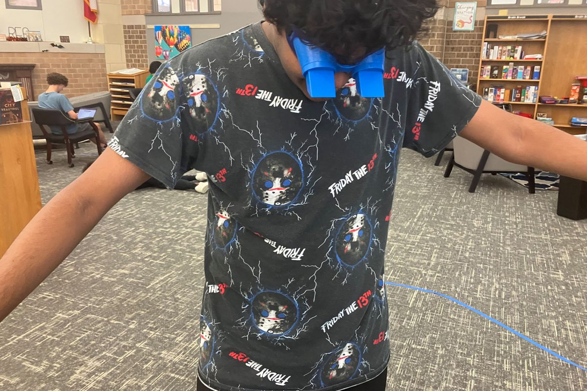  Junior Sirish Shabash attempts to follow a path while wearing goggles that give the sense of the world being upside down in order to test his perception. 
