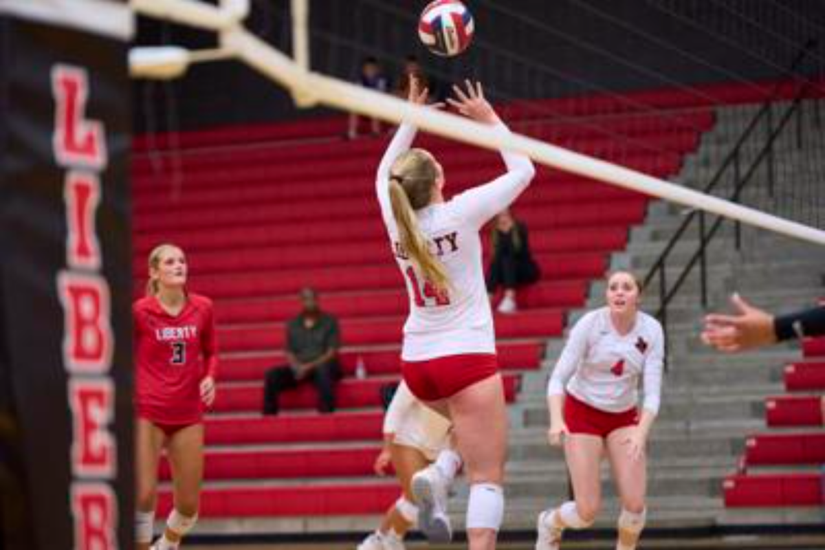 Junior outside hitter Jaiden Harris (#14) jumps to hit the ball for a kill during practice.