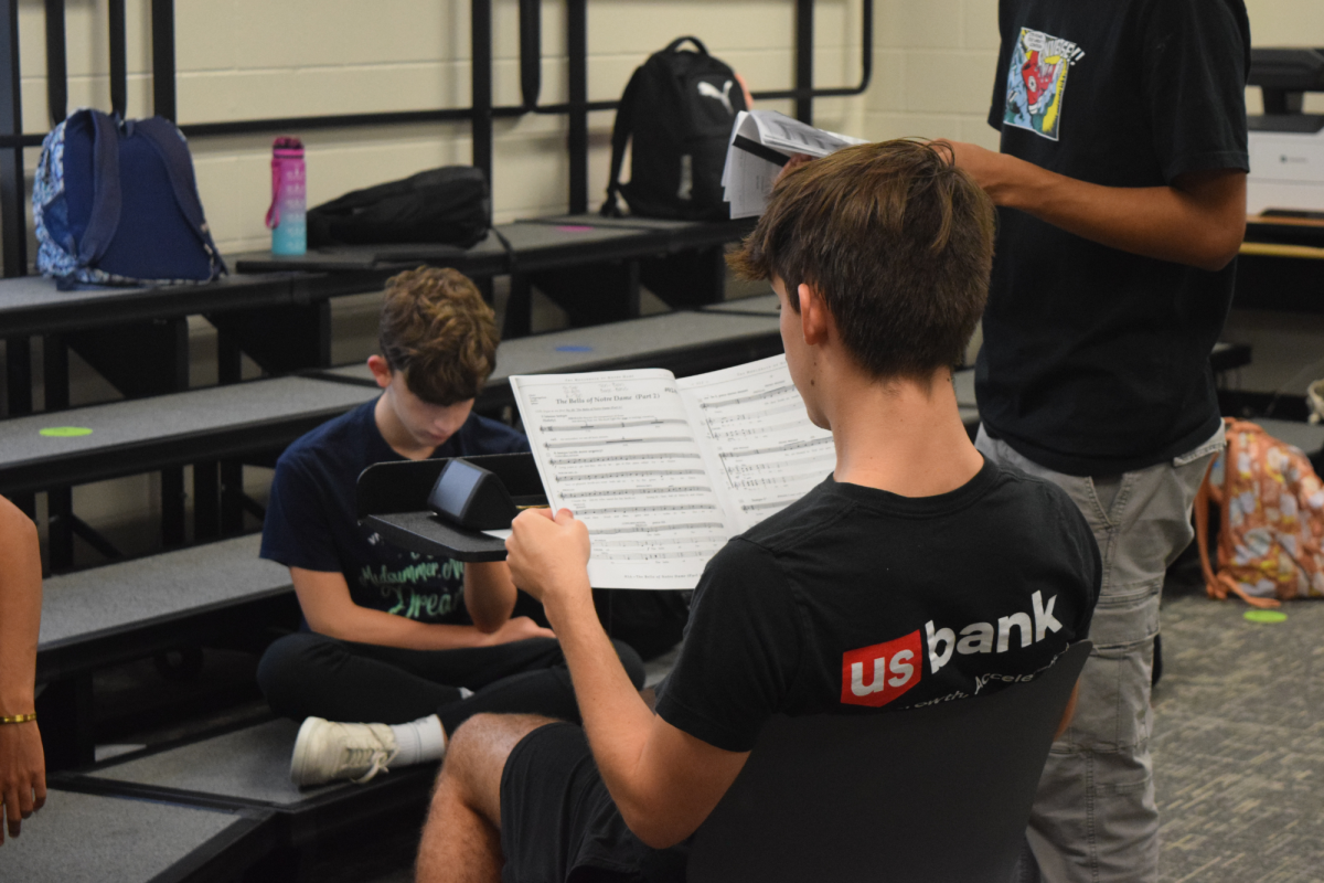 Senior Jeremy Jessop, who plays Frollo in The Hunchback of Notre Dame, reviews his music as he prepares for the upcoming performances, combining his talents in both choir and theater.