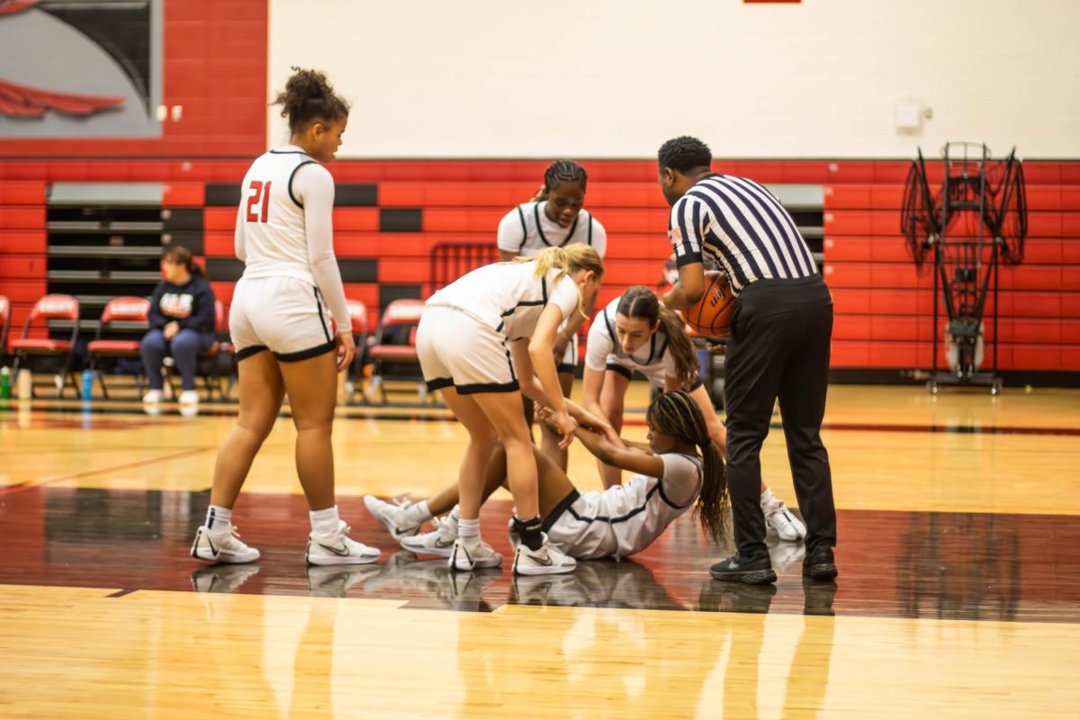 Senior Christina Webb took a fall during a game against eh Aussie Travellers, but was promptly helped up by their teammates. 