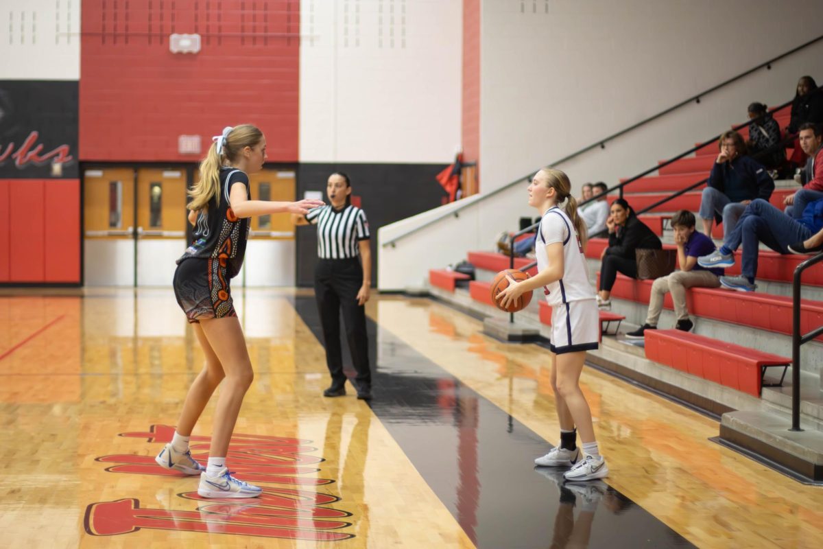 Traveller Liv Johnston and Redhawk Sam DeShetler face each other in a stand off in the third quarter. 