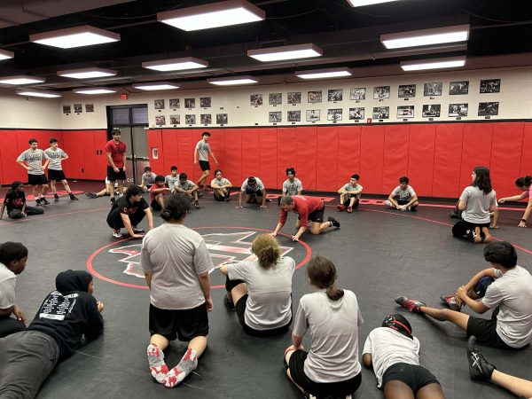 It was warm in the wrestling practice room where the coaches demonstrated moves, but it was a much different story outside when the wrestling team traveled to compete in the Trojan Classic.