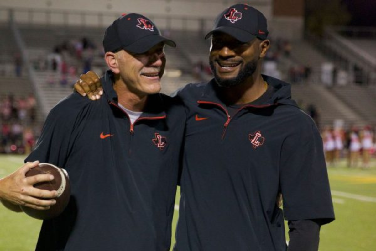 Former head football coach Matt Swinnea and new head coach for the 2025 season Chip Gregory are seen embracing after their win against Memorial. It was announced Tuesday Gregory will be promoted.