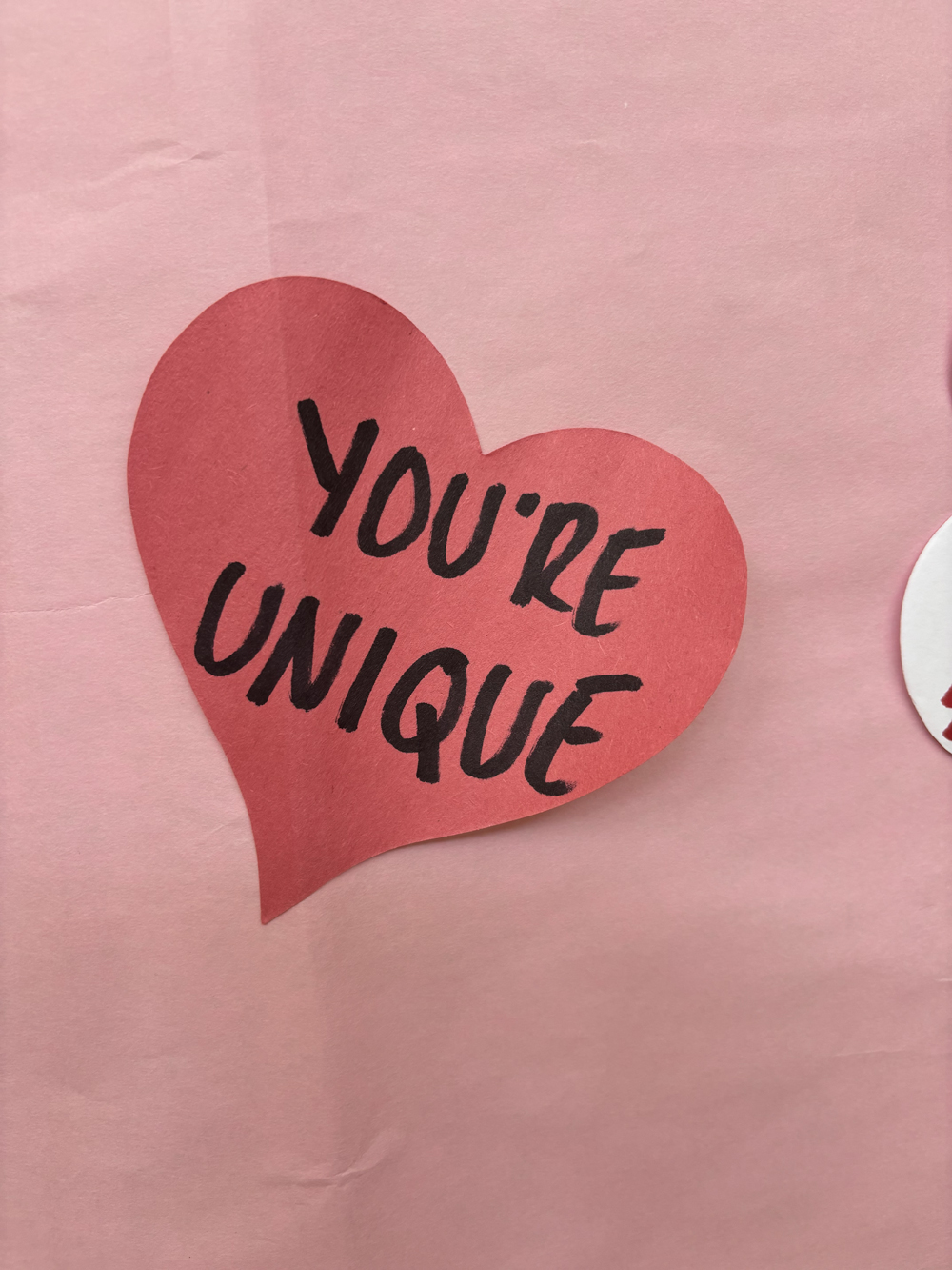 Students and staff left heart shaped messages on a poster in the rotunda for Valentine's Day. 