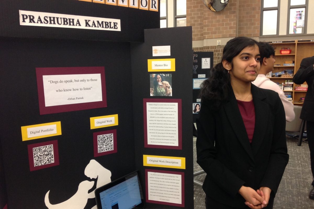 Independent Study and Mentorship students presented their semester-long research through a gallery walk, gaining professional communication experience while sharing their findings with peers and staff. For instance, senior Prashubha Kamble is seen above presenting her research on dog's body language. 