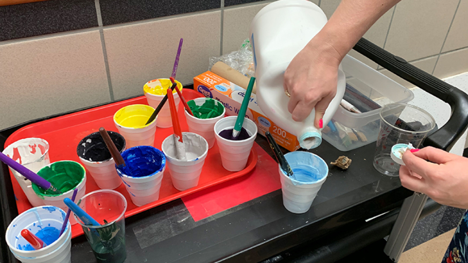 Students in Art 1 and Art 1 advanced step away from colorful paintings as they learn to incorporate monochromatic color schemes into 3-dimensional scenery. 