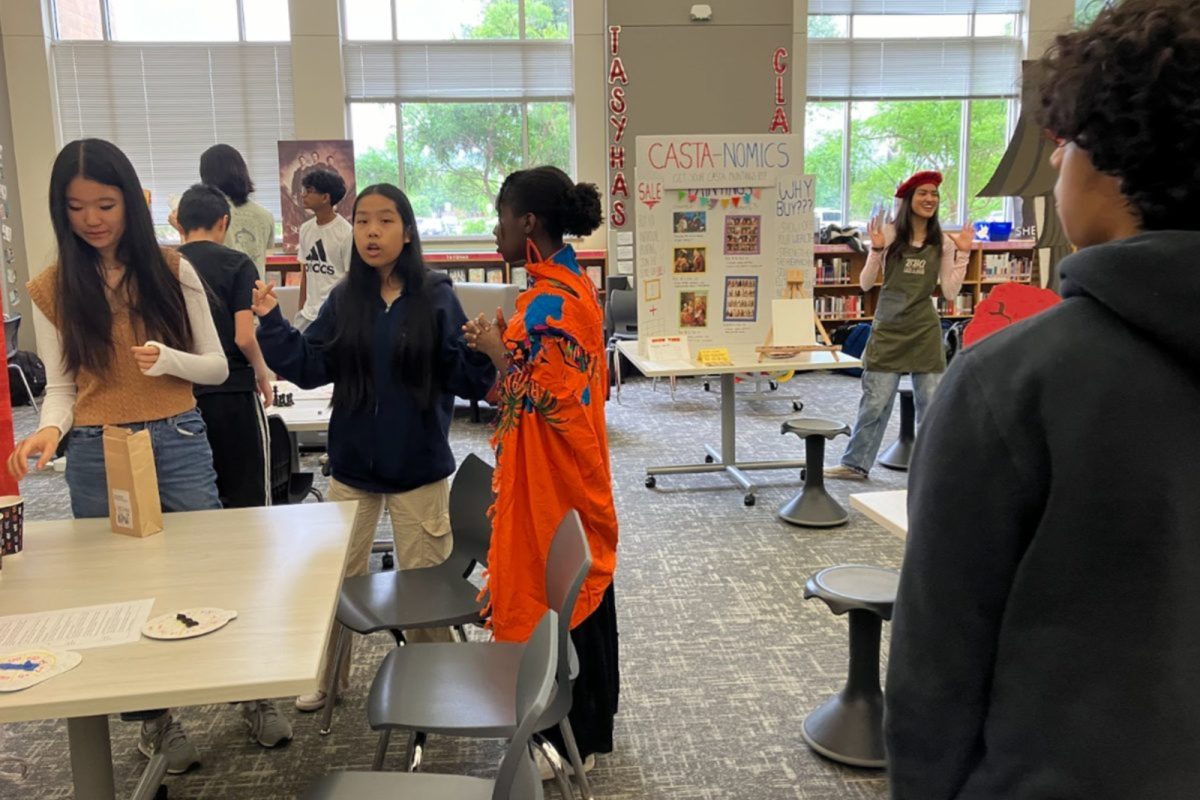 GT Humanities students are showcasing interactive booths at the school’s Renaissance Fair, combining economics research with creativity and hands-on presentations.